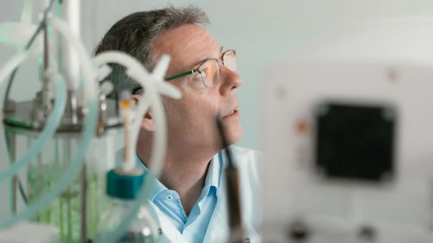 A photograph of John McGeehan at work.