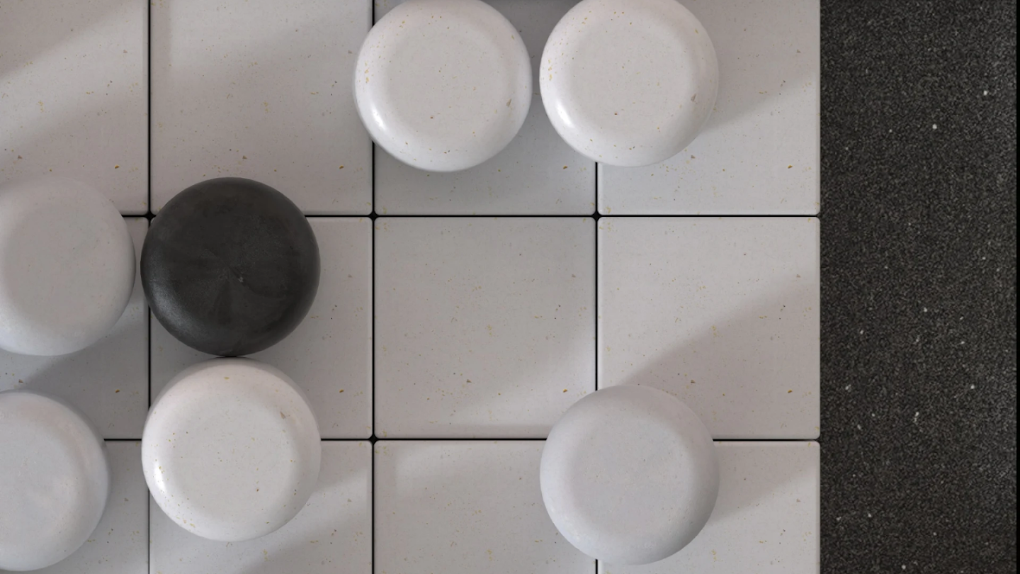 A Go board – a wide grid with black and white stones placed on top.