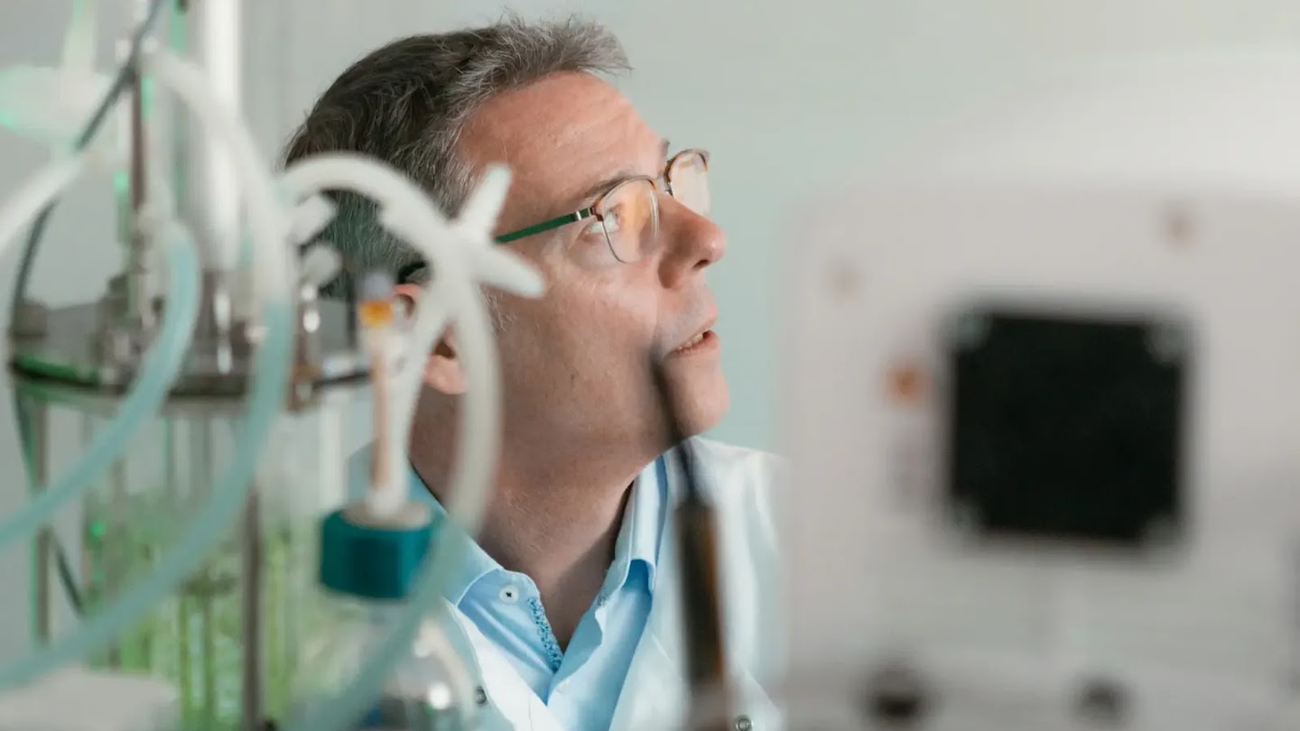 A photograph of John McGeehan at work.