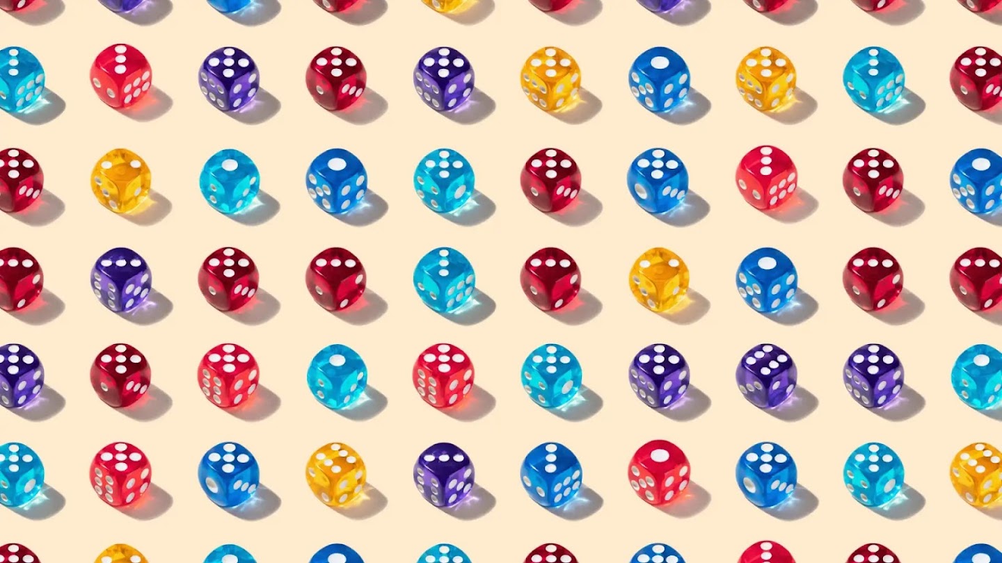 On a yellow background, there are neat rows of dice. They are different colours and showing different numbers